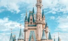 white and blue castle under blue sky and white clouds during daytime